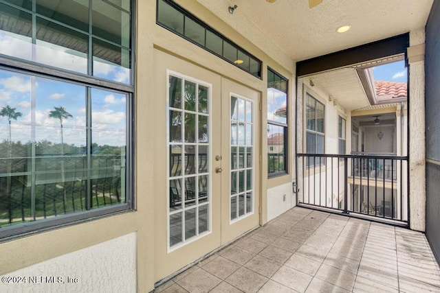 unfurnished sunroom with french doors