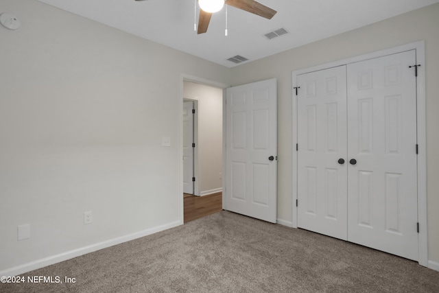 unfurnished bedroom featuring ceiling fan, carpet floors, and a closet