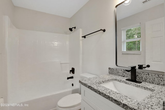 full bathroom featuring tub / shower combination, vanity, and toilet