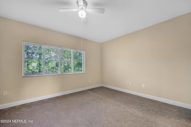 carpeted empty room with ceiling fan