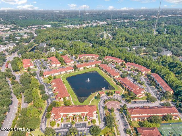 bird's eye view of a nearby body of water and a forest