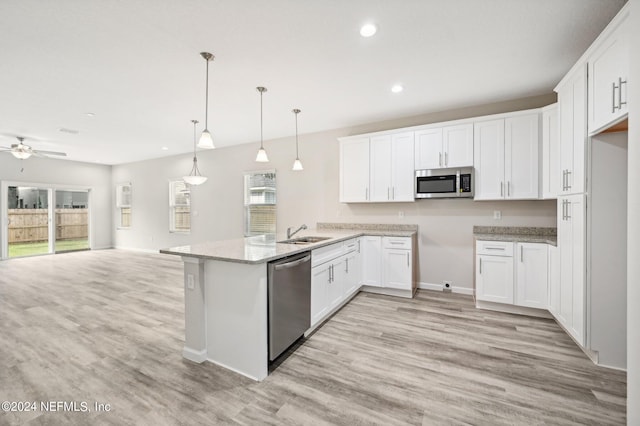 kitchen featuring pendant lighting, white cabinets, ceiling fan, appliances with stainless steel finishes, and kitchen peninsula