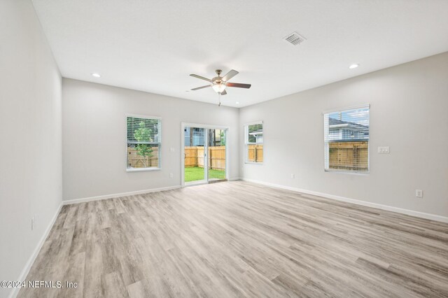 unfurnished room with light hardwood / wood-style floors and ceiling fan