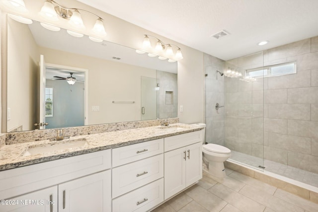 bathroom featuring vanity, tile patterned floors, a shower with door, and ceiling fan