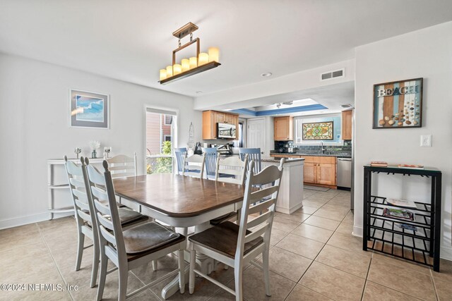 tiled dining space with sink