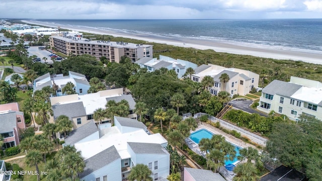 drone / aerial view featuring a water view and a view of the beach