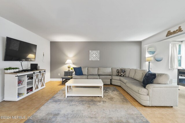 living room with light tile patterned floors