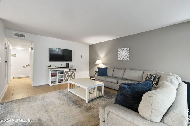 living room featuring tile patterned flooring