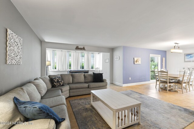 tiled living room featuring plenty of natural light