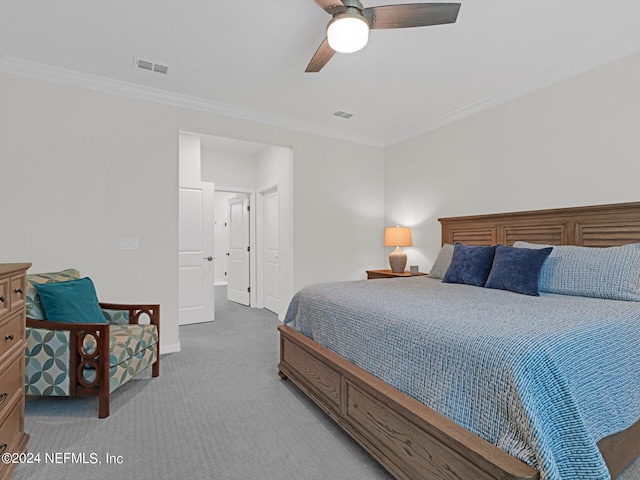 bedroom featuring ornamental molding, light carpet, visible vents, and baseboards