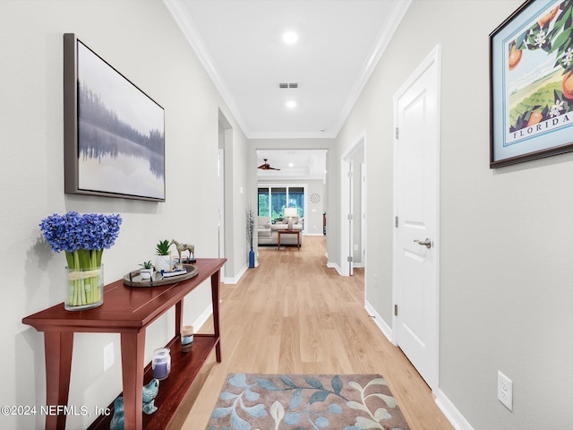 hall with recessed lighting, visible vents, ornamental molding, light wood-style floors, and baseboards