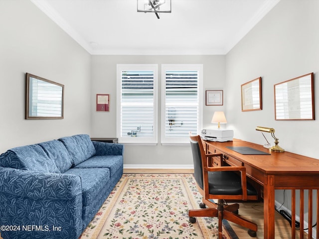 office space featuring baseboards, crown molding, and wood finished floors