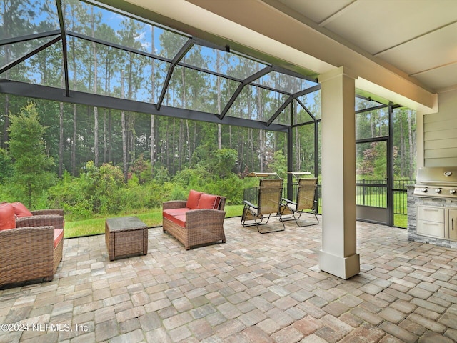 view of patio with glass enclosure, a grill, and an outdoor living space