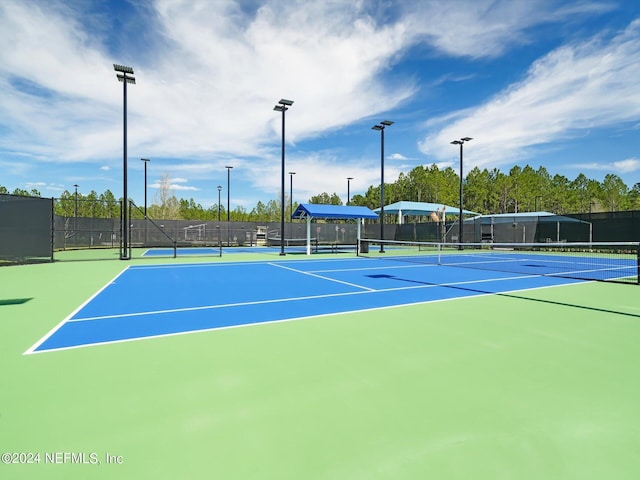 view of sport court with community basketball court and fence