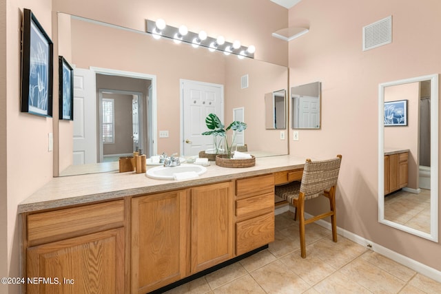 bathroom with vanity and tile patterned floors