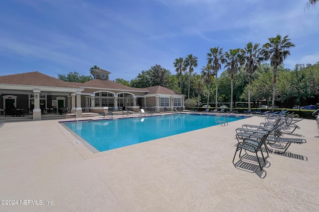 view of swimming pool with a patio area