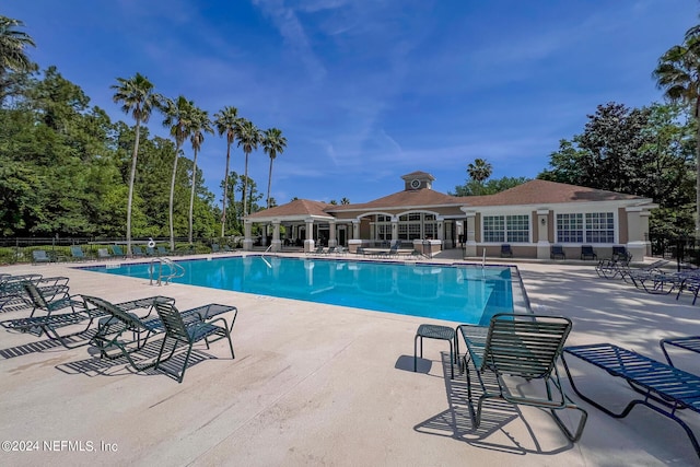 view of swimming pool with a patio area