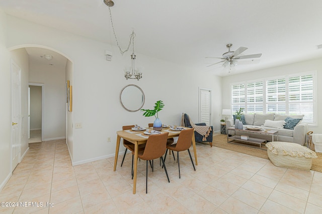 tiled dining area with ceiling fan