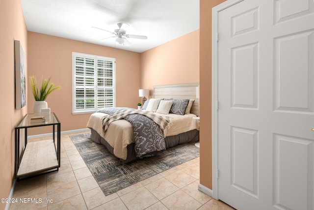 tiled bedroom with ceiling fan