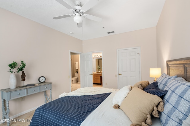 bedroom with ensuite bath and ceiling fan