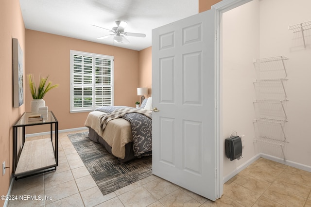 bedroom featuring ceiling fan and light tile patterned floors