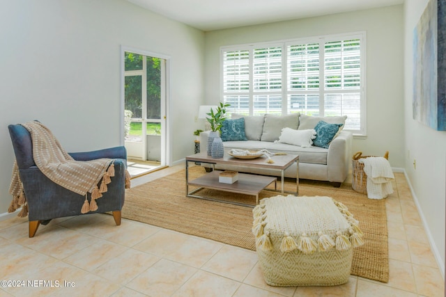 living room with a wealth of natural light and light tile patterned floors