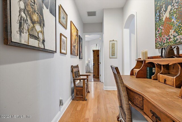 hallway with light wood-type flooring