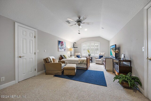 living room with a textured ceiling, light colored carpet, ceiling fan, and vaulted ceiling