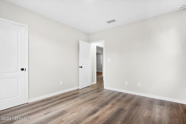 empty room featuring hardwood / wood-style floors