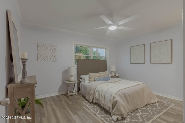 bedroom featuring ceiling fan and light hardwood / wood-style floors