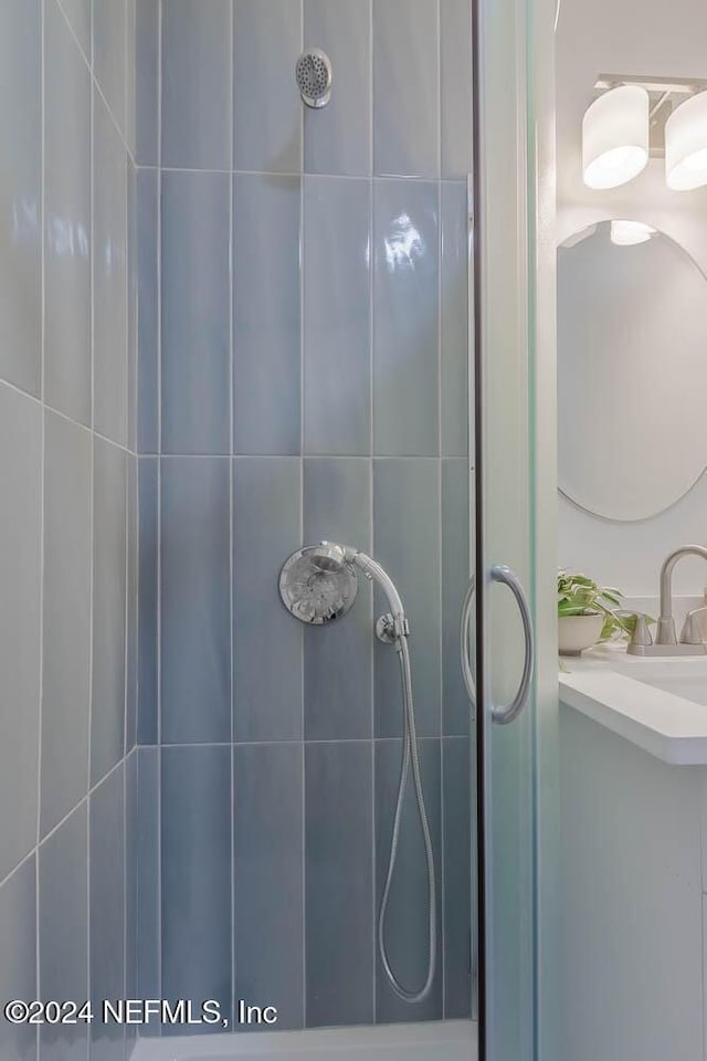 bathroom with vanity and walk in shower