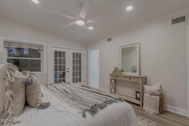 bedroom featuring french doors, vaulted ceiling, ceiling fan, access to exterior, and light hardwood / wood-style floors