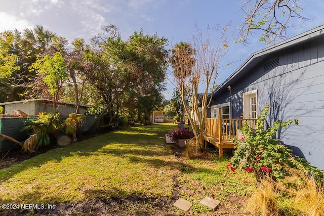 view of yard featuring a deck