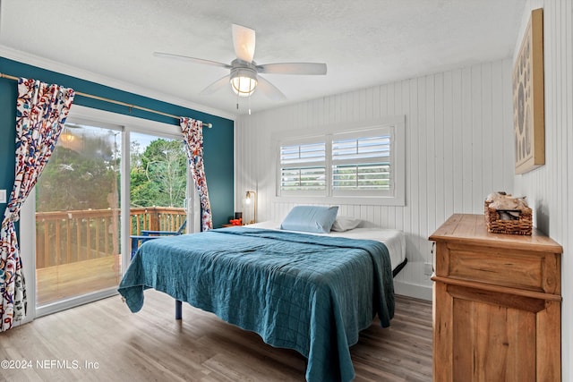 bedroom featuring a textured ceiling, access to exterior, ceiling fan, and hardwood / wood-style floors