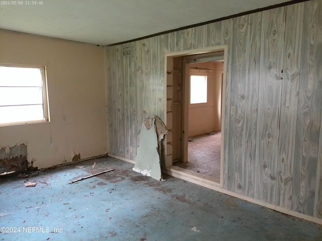 spare room featuring crown molding