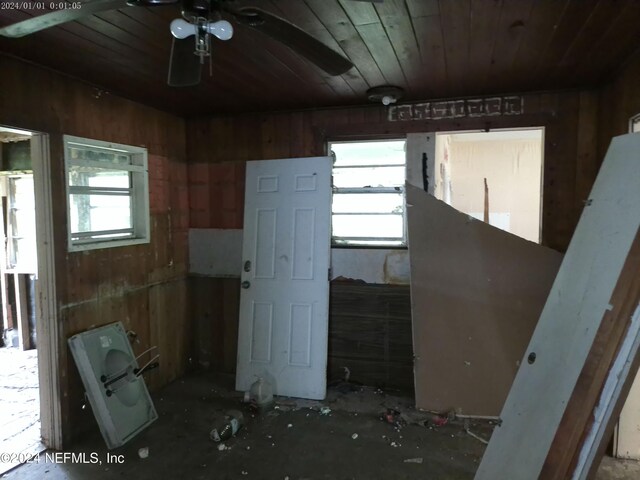 interior space featuring wood ceiling and ceiling fan