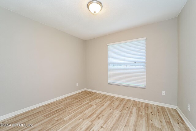 unfurnished room featuring light hardwood / wood-style flooring