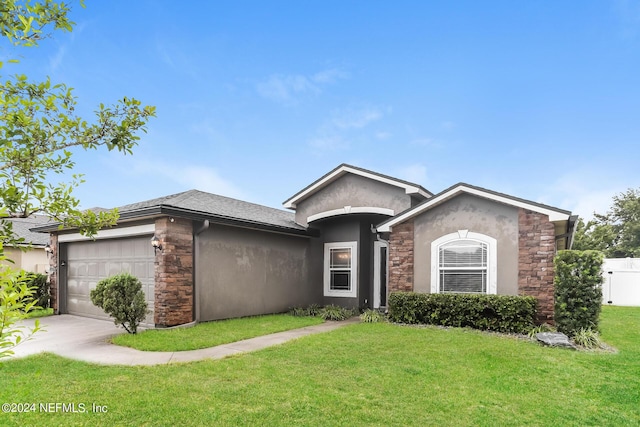 ranch-style home featuring concrete driveway, stone siding, an attached garage, a front lawn, and stucco siding