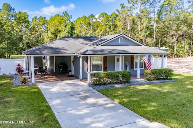 view of front of home featuring a front yard and a porch