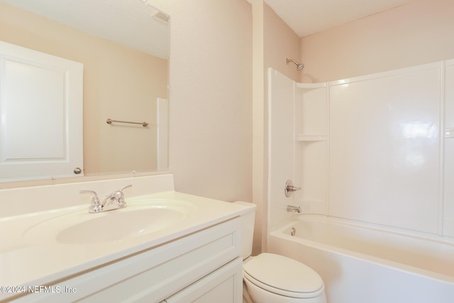 full bathroom featuring vanity, toilet, and shower / bathtub combination