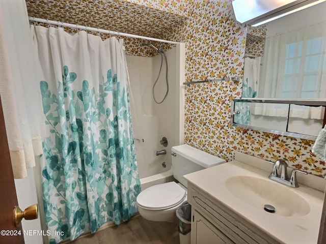 full bathroom featuring shower / bath combo with shower curtain, wood-type flooring, toilet, and vanity