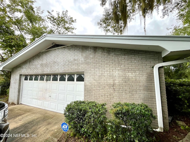 view of side of property featuring a garage