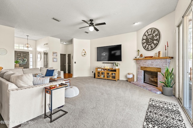 9042 Ford Rd, Bryceville, FL 32009 - carpeted living room with a brick fireplace, visible vents, a ceiling fan, and baseboards