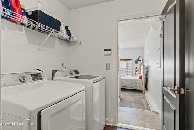 9042 Ford Rd, Bryceville, FL 32009 - clothes washing area with carpet, a textured ceiling, independent washer and dryer, and laundry area