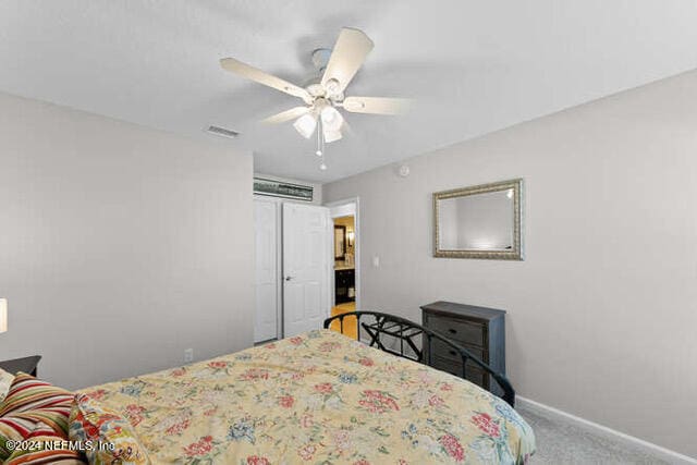 bedroom with ceiling fan and carpet floors