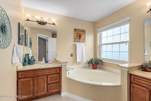 bathroom with vanity, tile patterned flooring, a textured ceiling, and a bathing tub