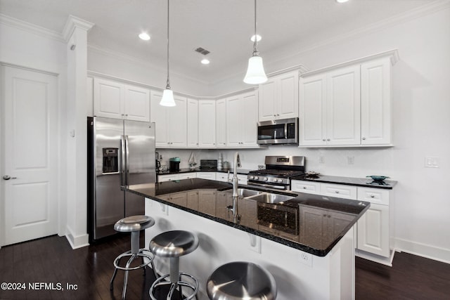 kitchen featuring dark wood finished floors, stainless steel appliances, and ornamental molding