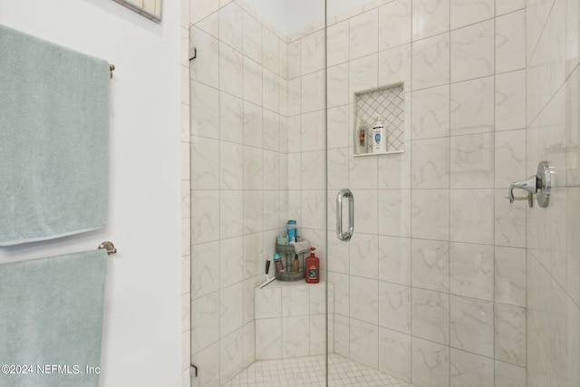 bathroom featuring a shower stall