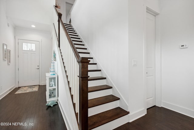 stairway with recessed lighting, wood finished floors, and baseboards