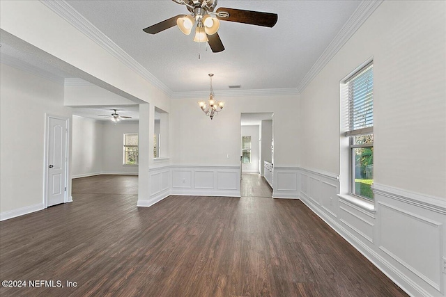 unfurnished room featuring a chandelier, ornamental molding, a textured ceiling, and dark wood-type flooring